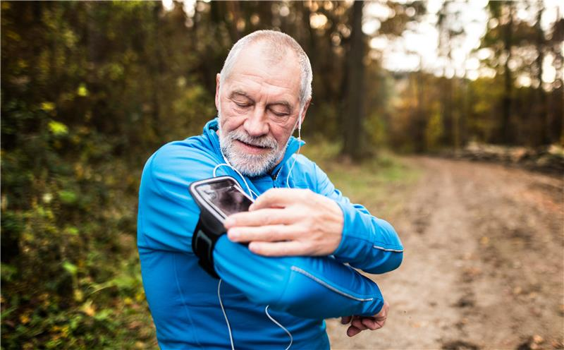 Man in blue top with wearable device