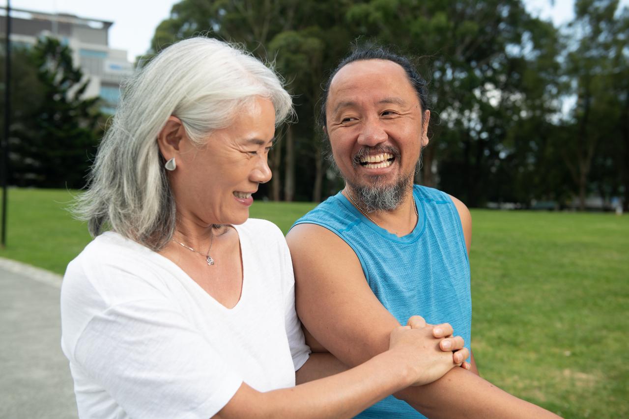 Couple smiling in park