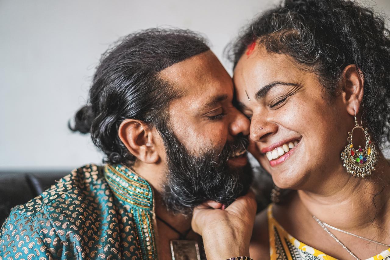 Smiling couple sharing an affectionate moment.