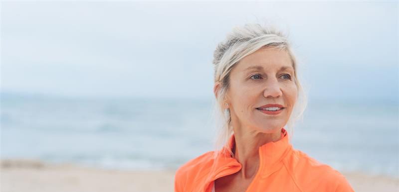 Pancreatic  cancer header image with woman at the beach