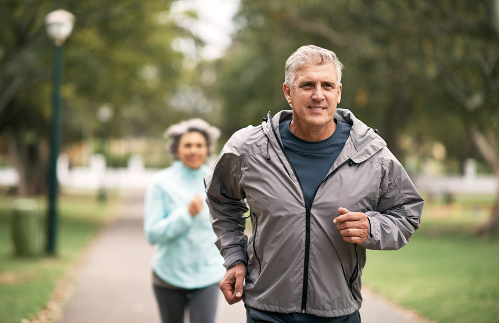 Shot of a senior couple out for a run in the park