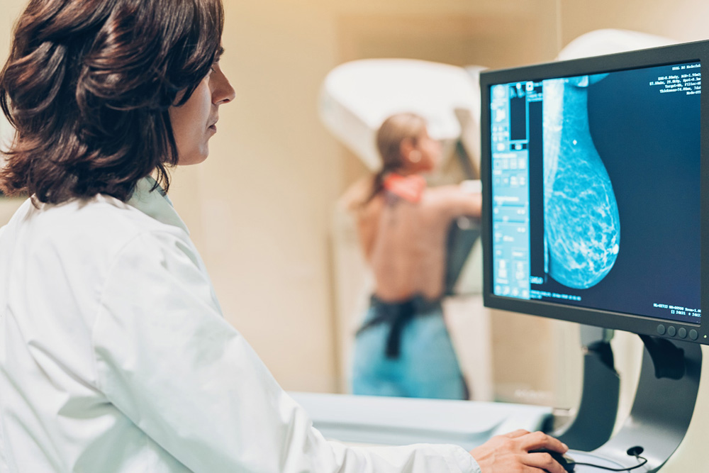 Doctor and patient making a mammography