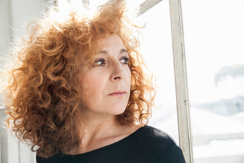 Woman glancing out window