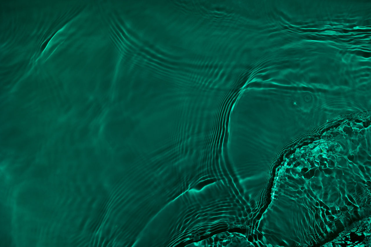 Transparent dark green clear water surface texture with ripples, splashes. Abstract nature background Water waves in sunlight with copy space, top view. Cosmetic moisturizer micellar toner emulsion; Shutterstock ID 2170577463; purchase_order: Use up 22/23 credit; job: Use up 22/23 credit; client: Use up 22/23 credit; other: Use up 22/23 credit