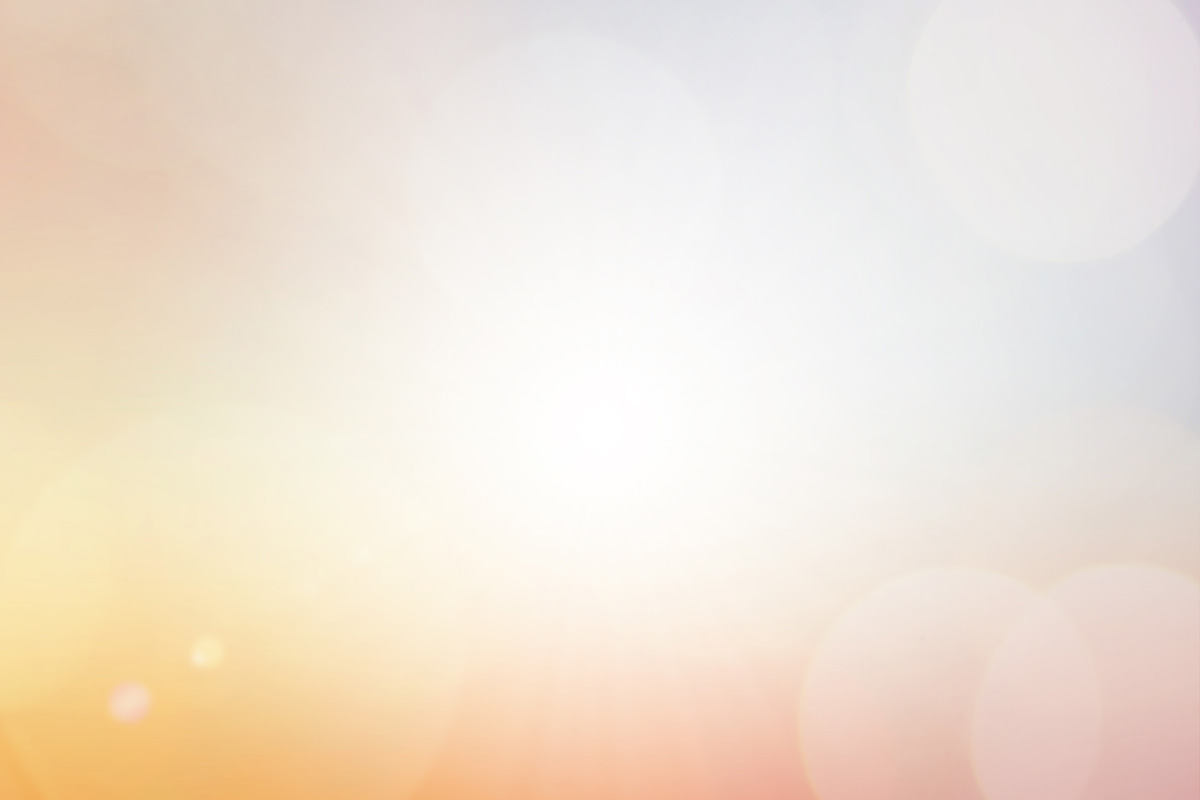 abstract blur orange and yellow color tone background with glowing sparkle light and bokeh for design element as presentation,banner,ads concept
